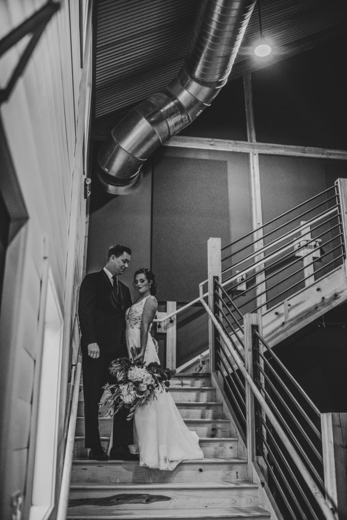 wedding couple fete of wales stairway modern barn