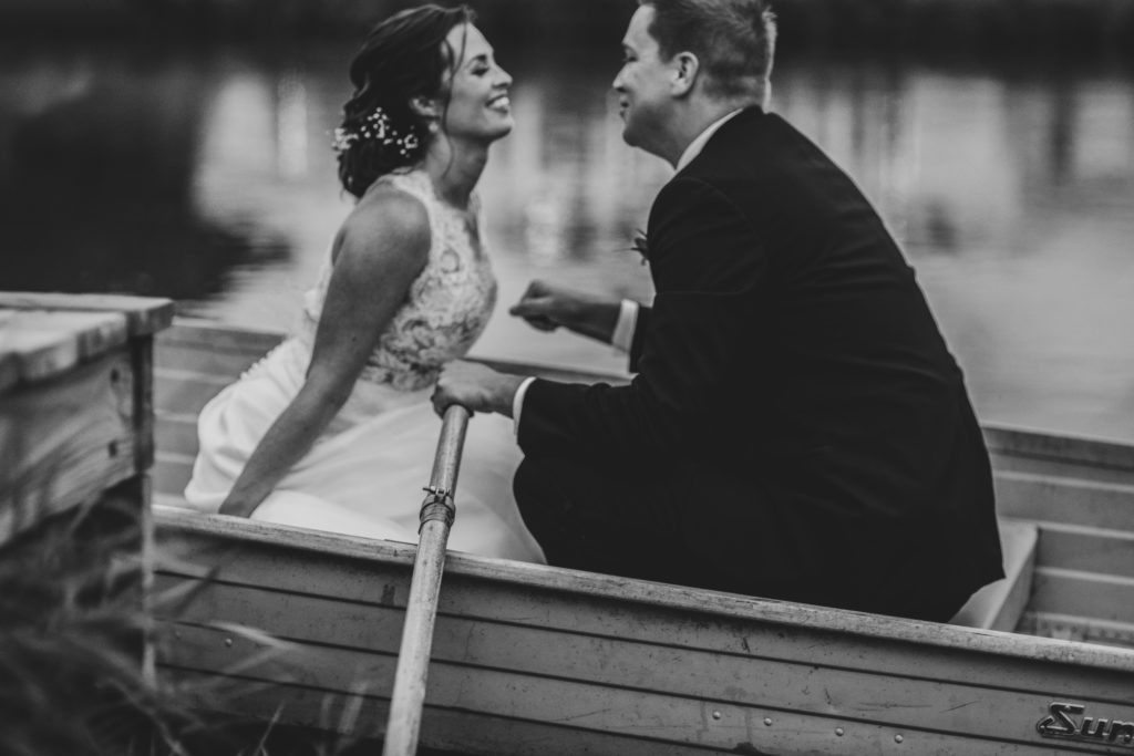 bride and groom row boat