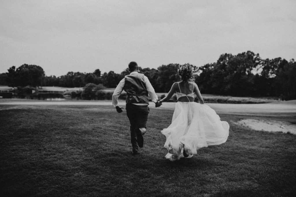 black and white wedding couple running inspo