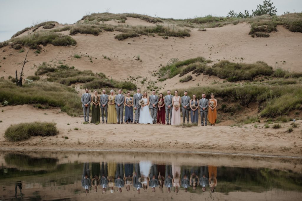 wedding party with sand dunes